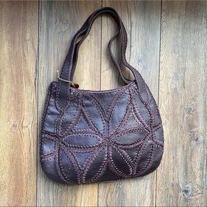 Brown, “The Sak Pink Label” handbag .